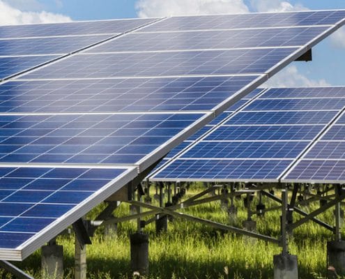 field with path and solar panels