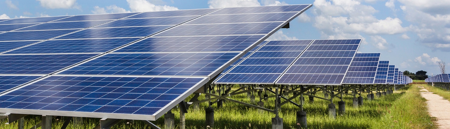 field with path and solar panels